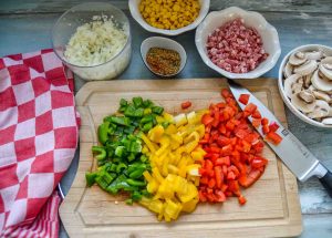 Rezept Zutaten Paprika, Zwiebel, Gewürze, Pilze und Mais